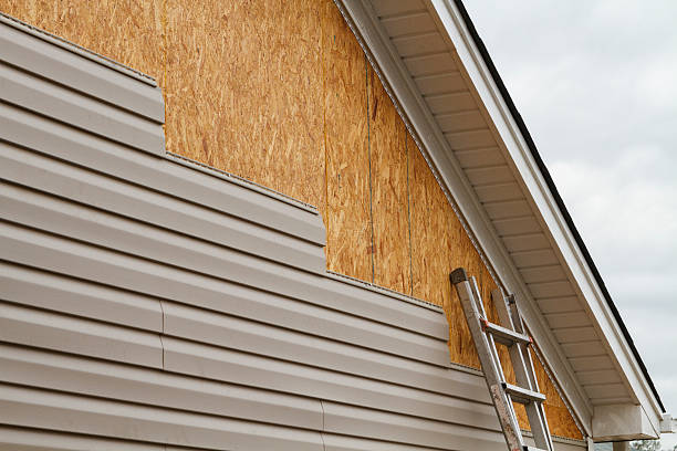 Professional Storm Damage Siding Repair technician working in Wimauma, FL